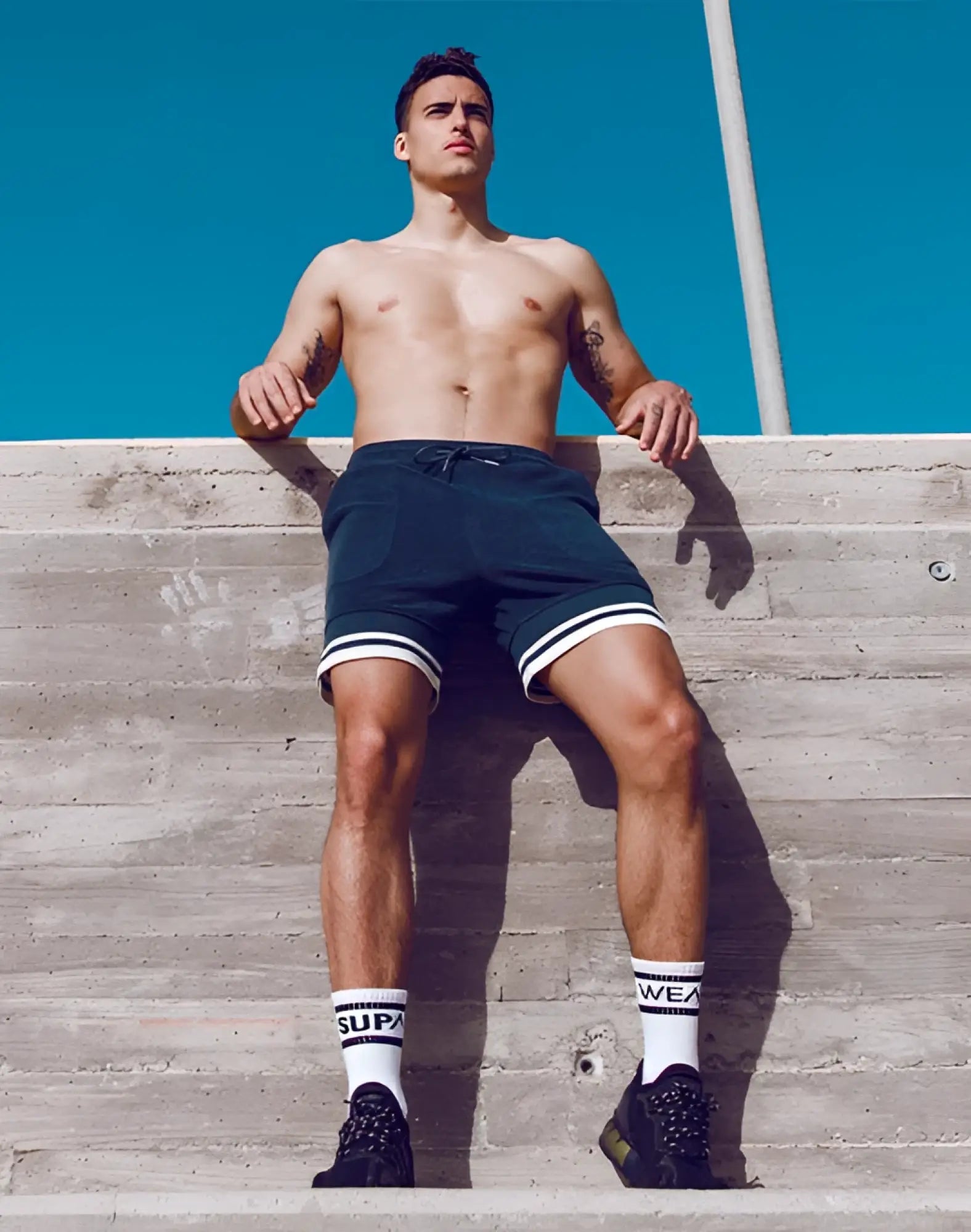 Black supawear terry towelling shorts with white trim and drawstring waistband for athletic use