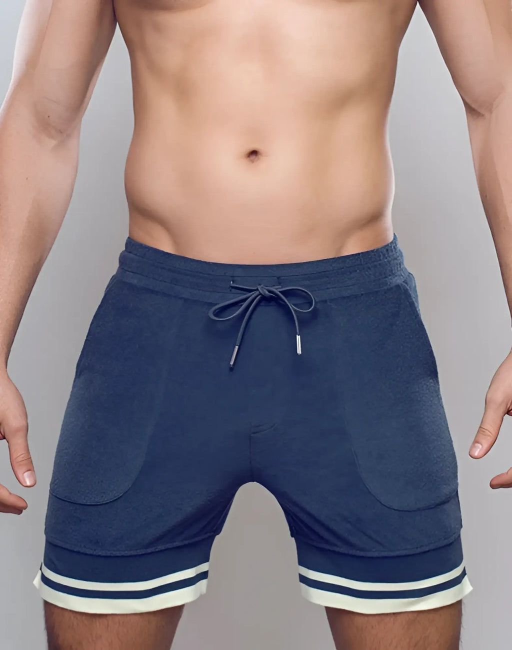Navy supawear terry towelling shorts with white and dark blue striped cuffs and matching drawstring waistband