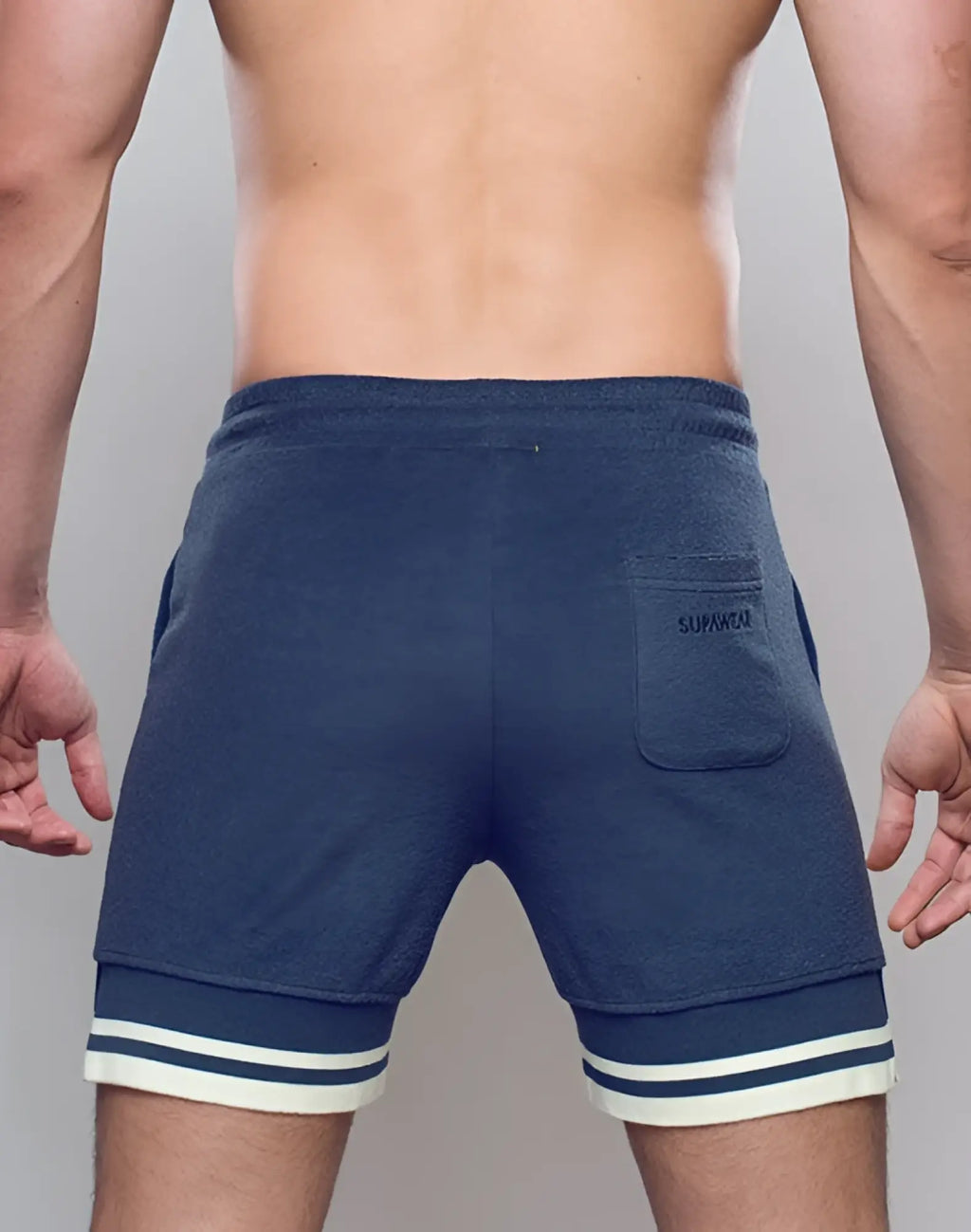 Navy supawear terry towelling sweatshorts with white and dark blue striped cuffs and front pocket logo detail