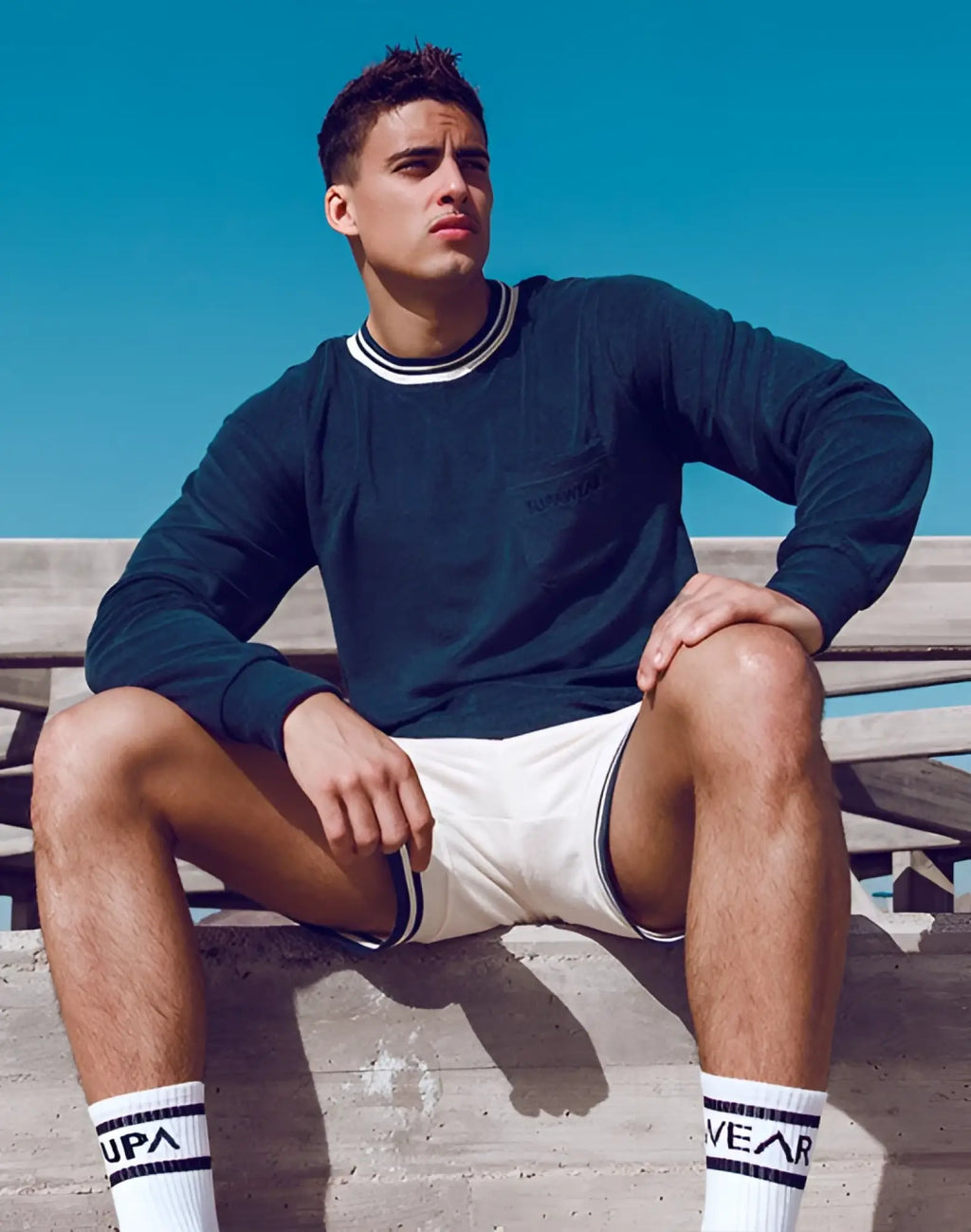 Navy supawear terry towelling sweater with dark blue fabric and white black striped collar and sleeve cuffs