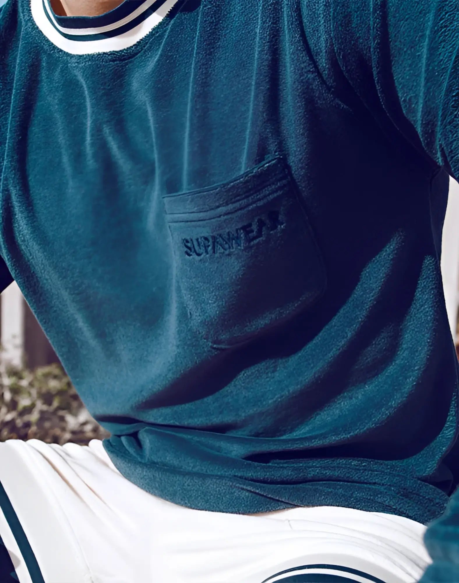Teal velvet long sleeve t shirt with white and navy striped collar and supreme logo on chest pocket