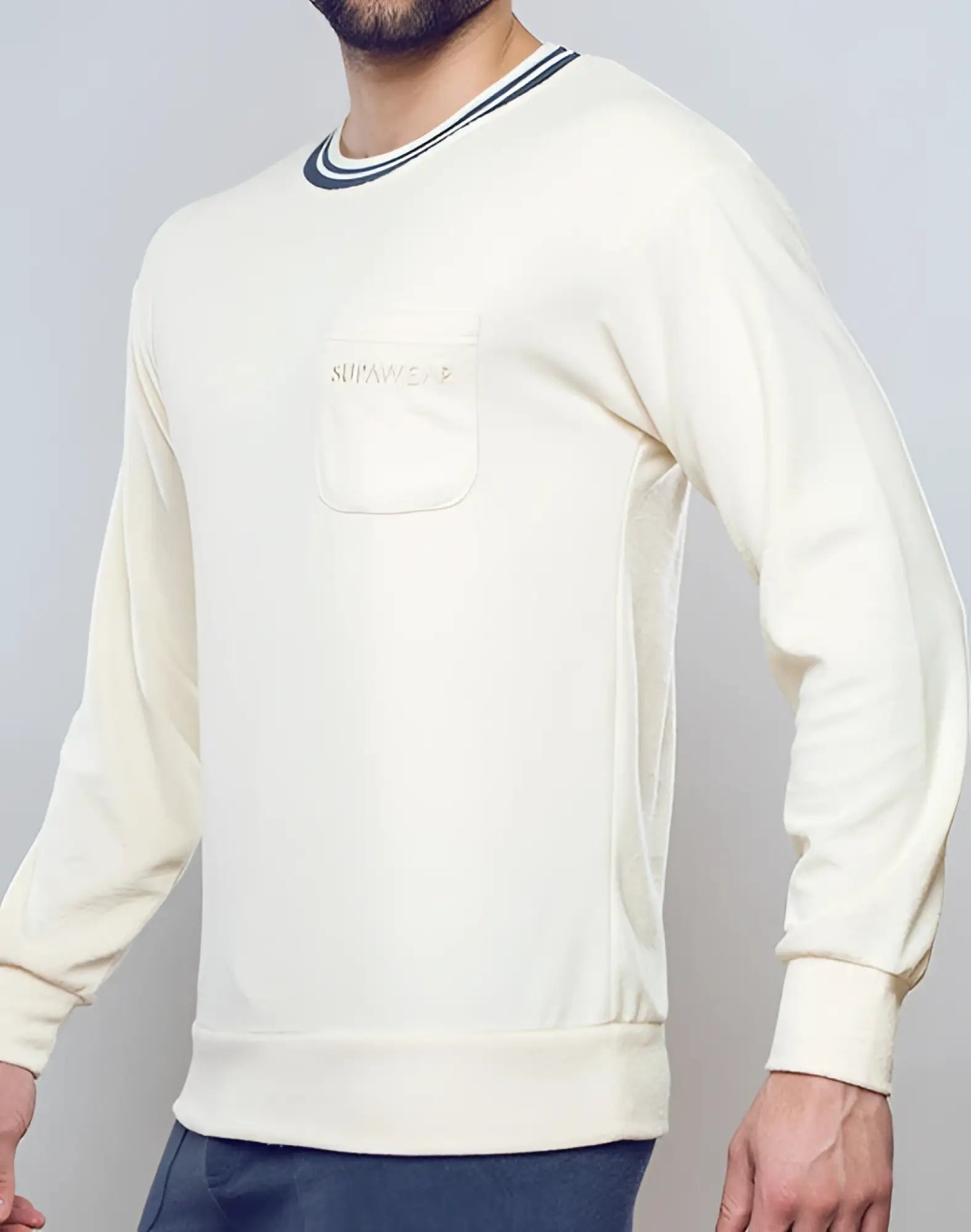 Cream-colored supawear terry towelling sweatshirt with ribbed crew neck cuffs and gold embroidered surfwear front pocket