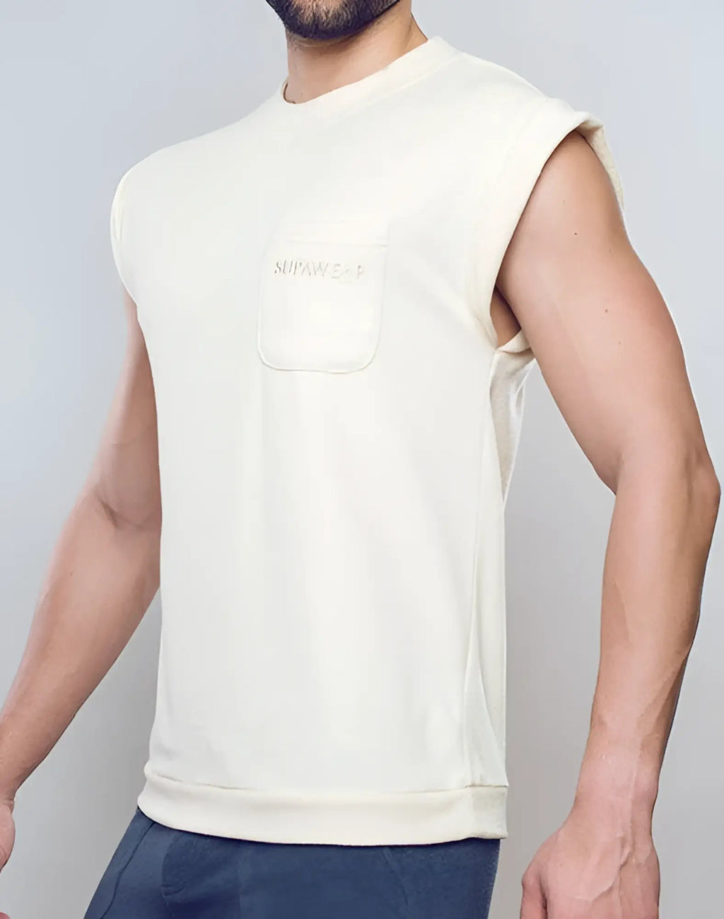Cream-colored off white supawear terry towelling sleeveless sweatshirt tank with front pocket and subtle embroidered logo