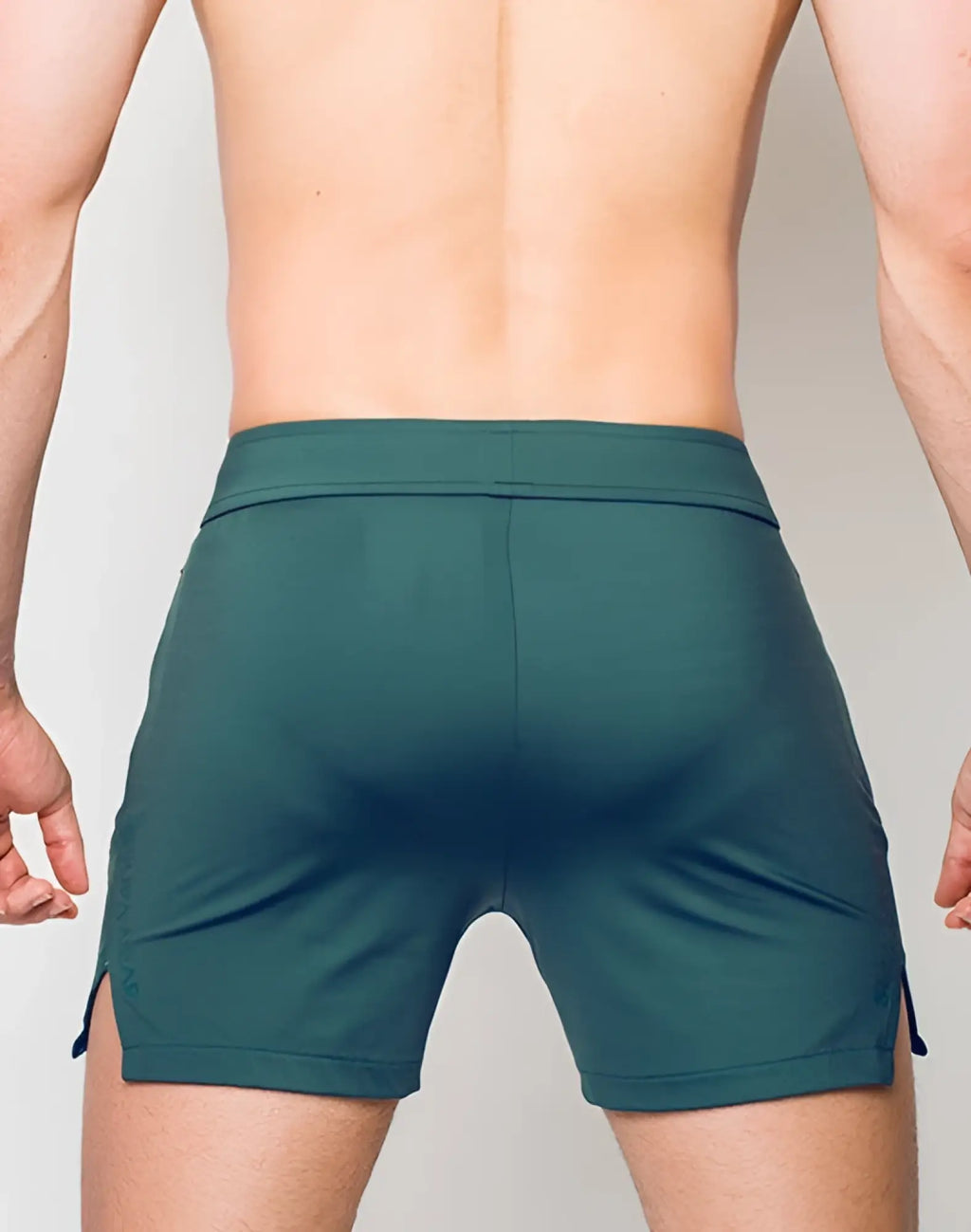 SupaWear training shorts in nexus dark green with fitted waistband and side slits for athletic performance