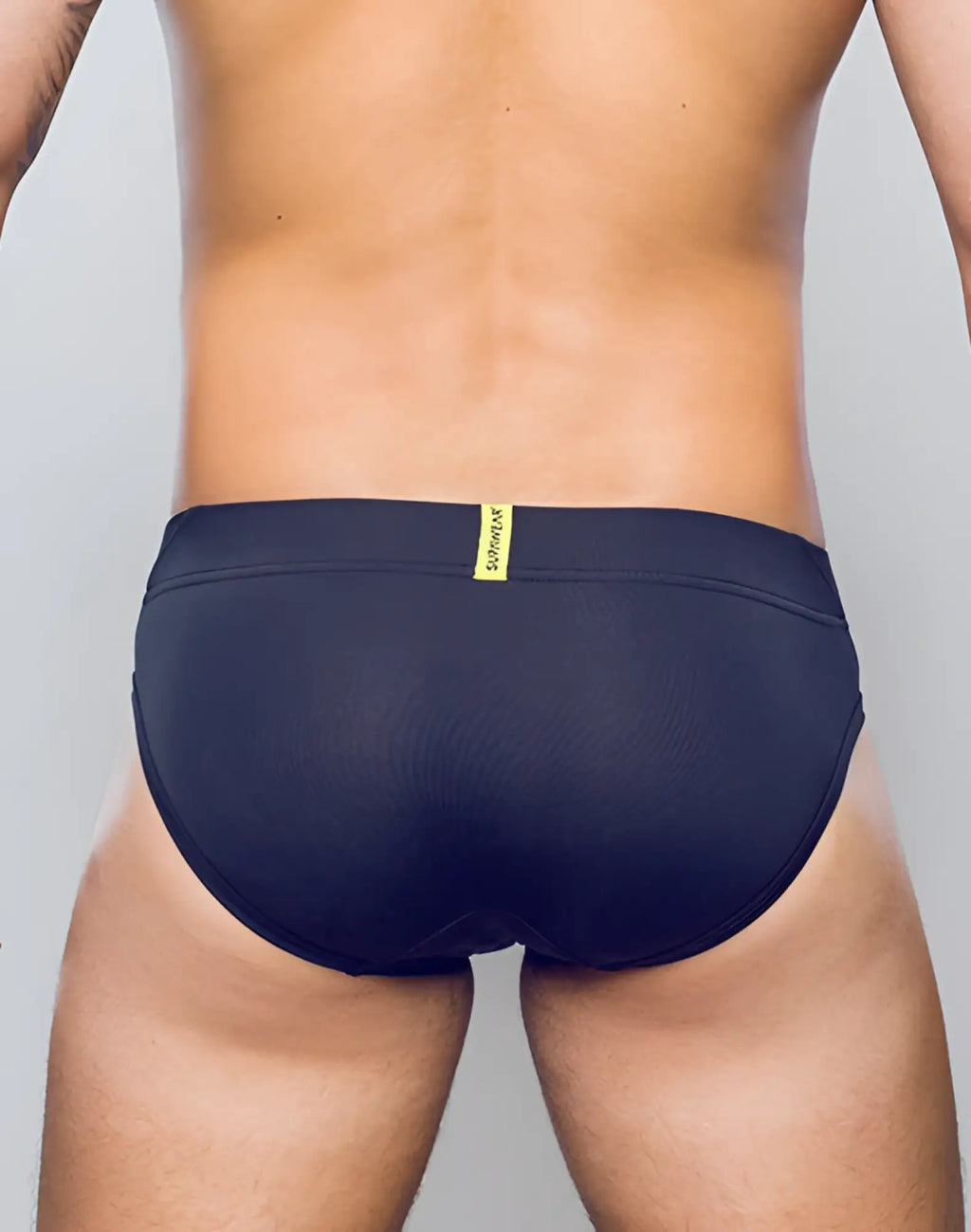 SupaWear Vortex brief underwear in black mesh fabric with a yellow brand tag at the waistband