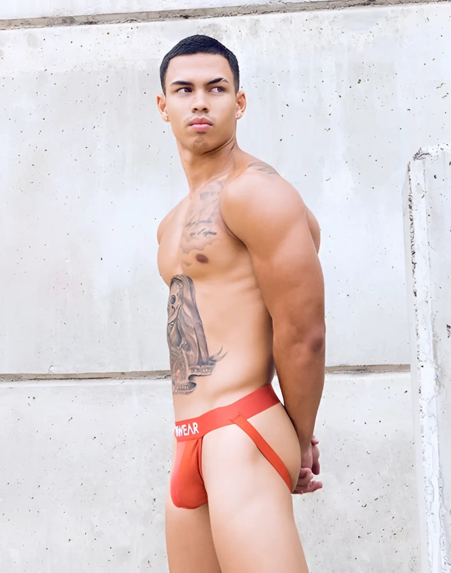 Orange red briefs underwear with wear logo on waistband from supawear vortex jockstrap cranberry collection