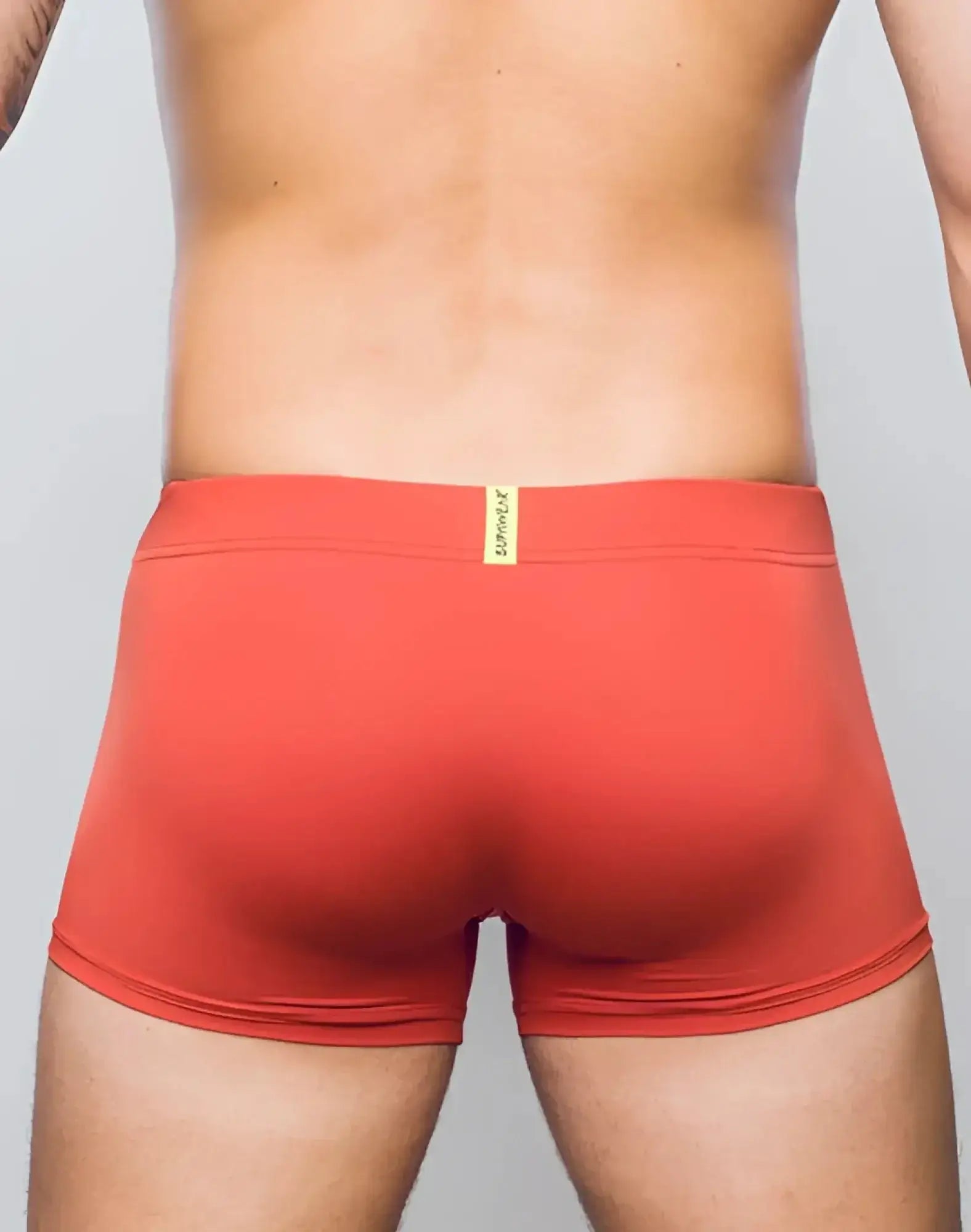 Supawea vortex trunk underwear in cranberry red with a yellow brand tag at the waistband designed for men