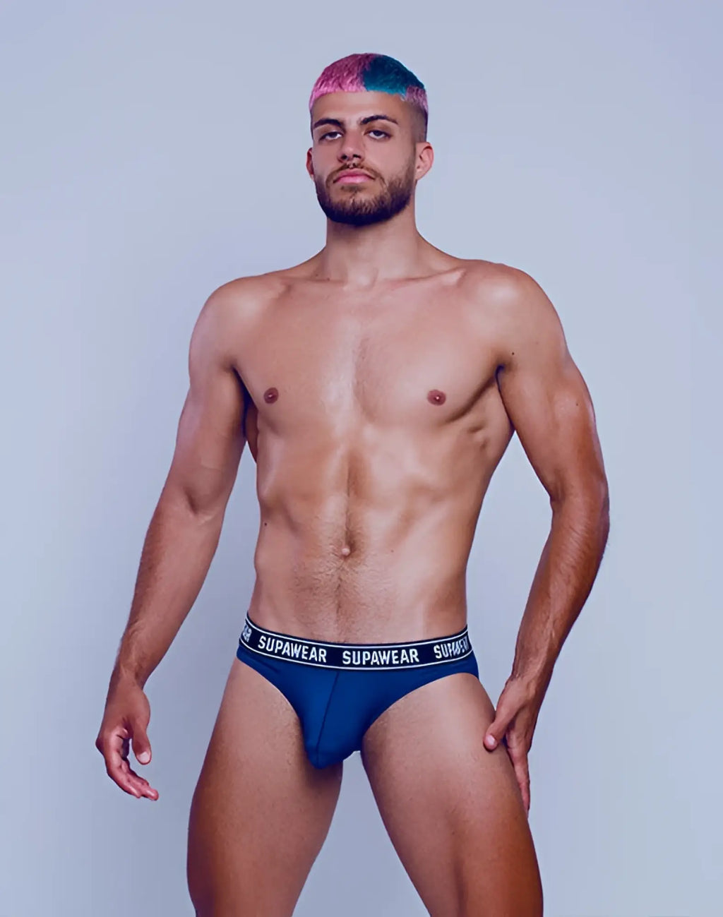 Navy supawear wow brief underwear with white elastic waistband featuring repeating supawear branding