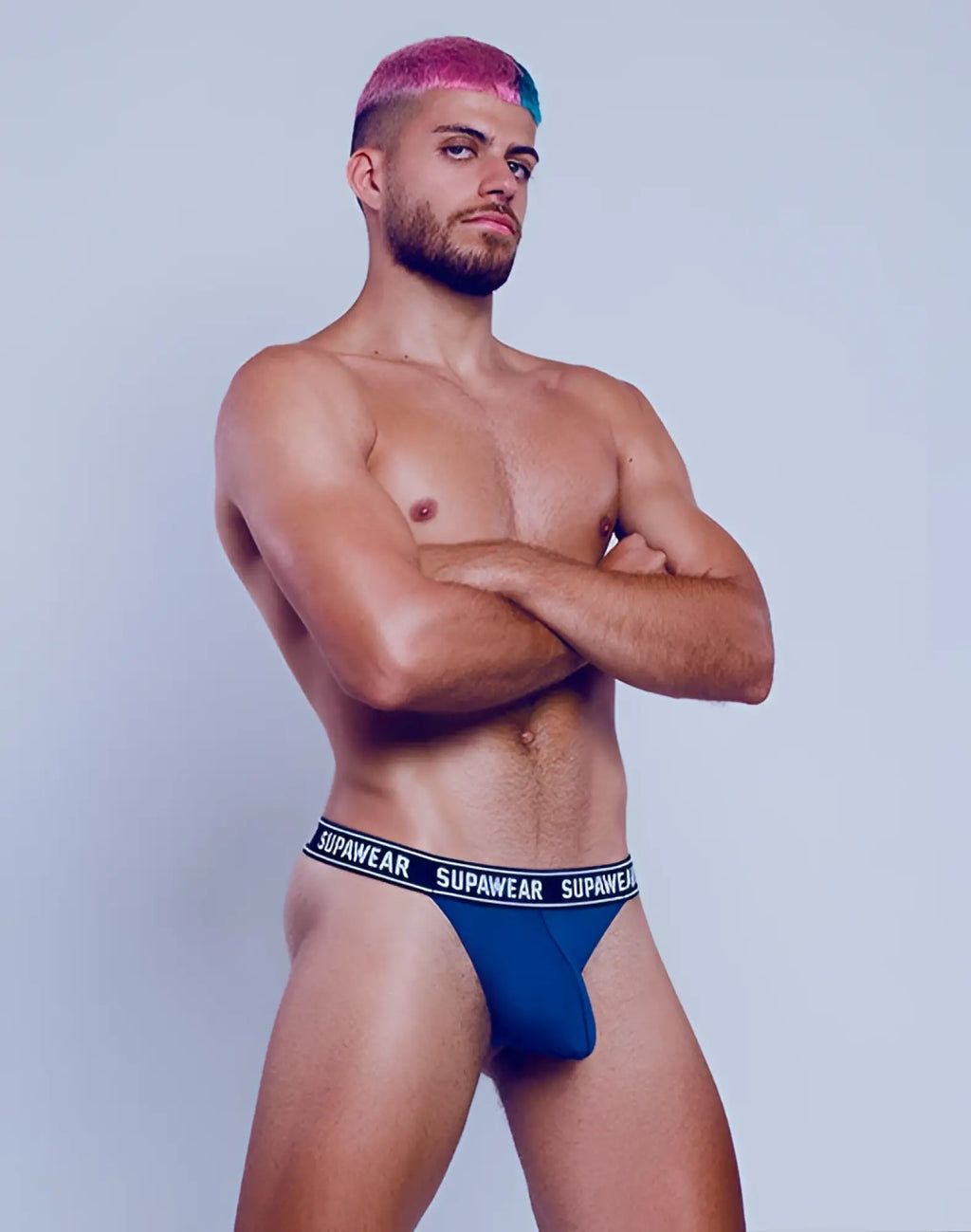 Navy supawear wow thong underwear with blue fabric and a black waistband featuring supawear branding in white