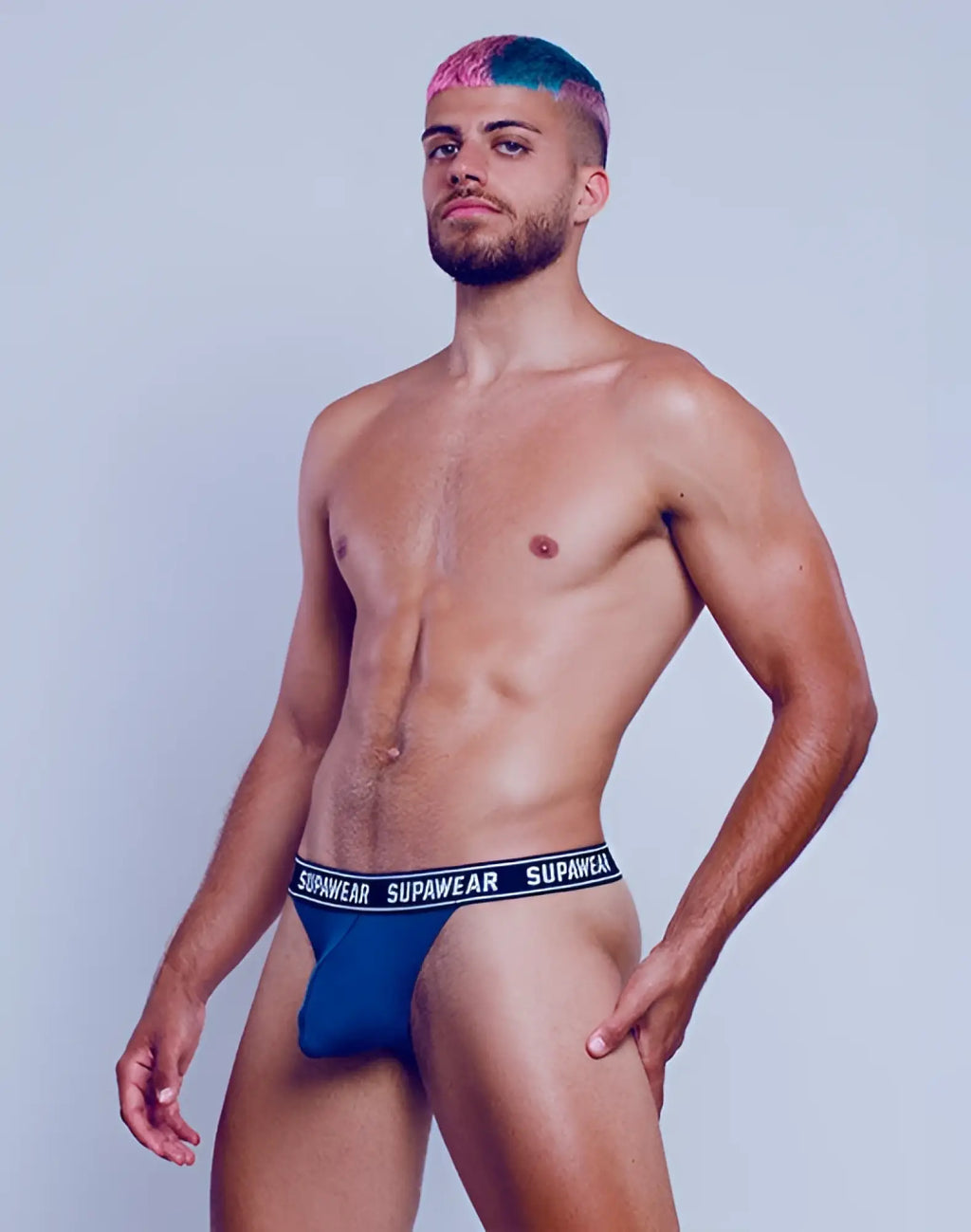 Blue Supawear Wow thong underwear in navy with black elastic waistband showcasing the back side of briefs