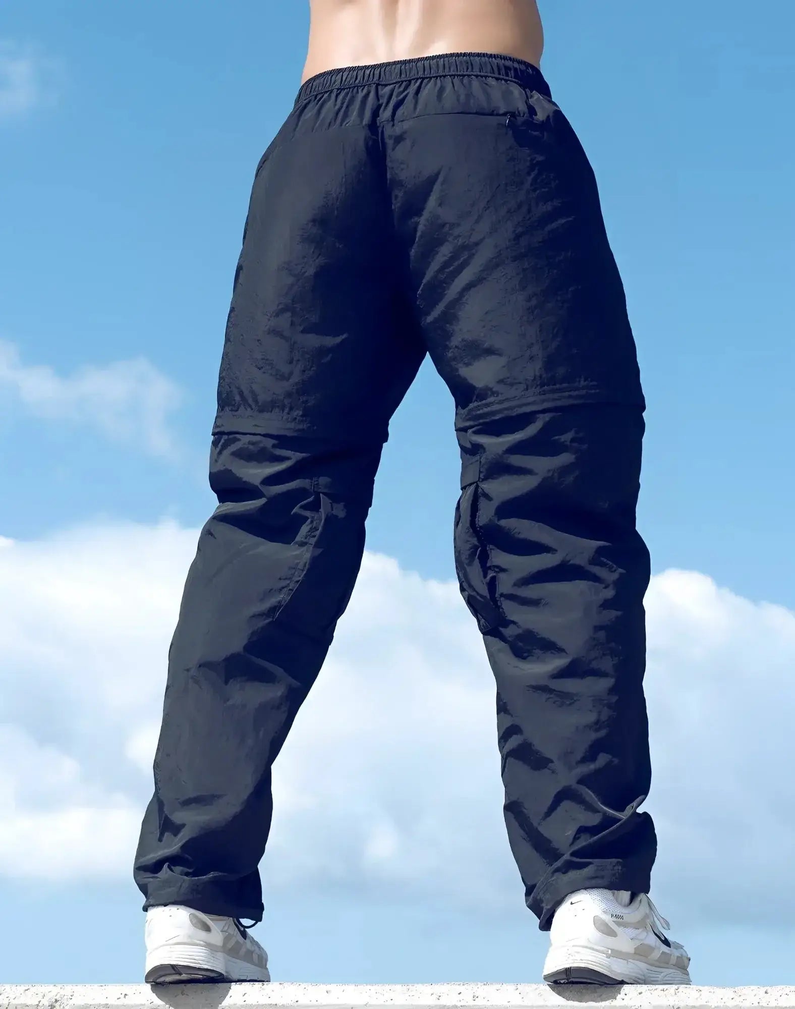 Black supawear zip-off trouser with elastic waistband and multiple pockets designed for versatile wear