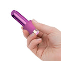 Purple metallic lipstick-shaped vibrator with textured grip and clear led light base for comfortable use