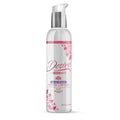 A clear plastic bottle with silver pump labeled desire by Swiss Navy water based intimate lubricant 4oz with floral design