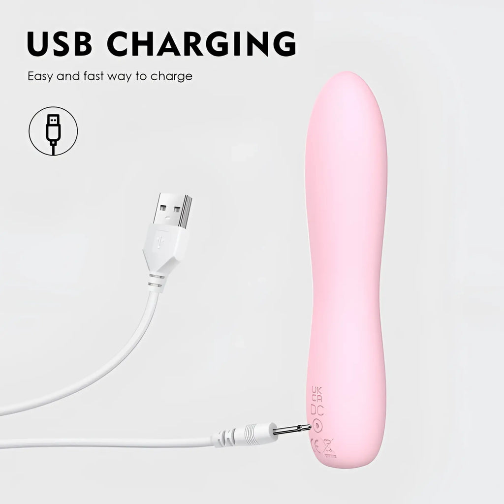 Pink silicone sxE Bella 140mm usb-charged bullet massager with white charging cable for personal use