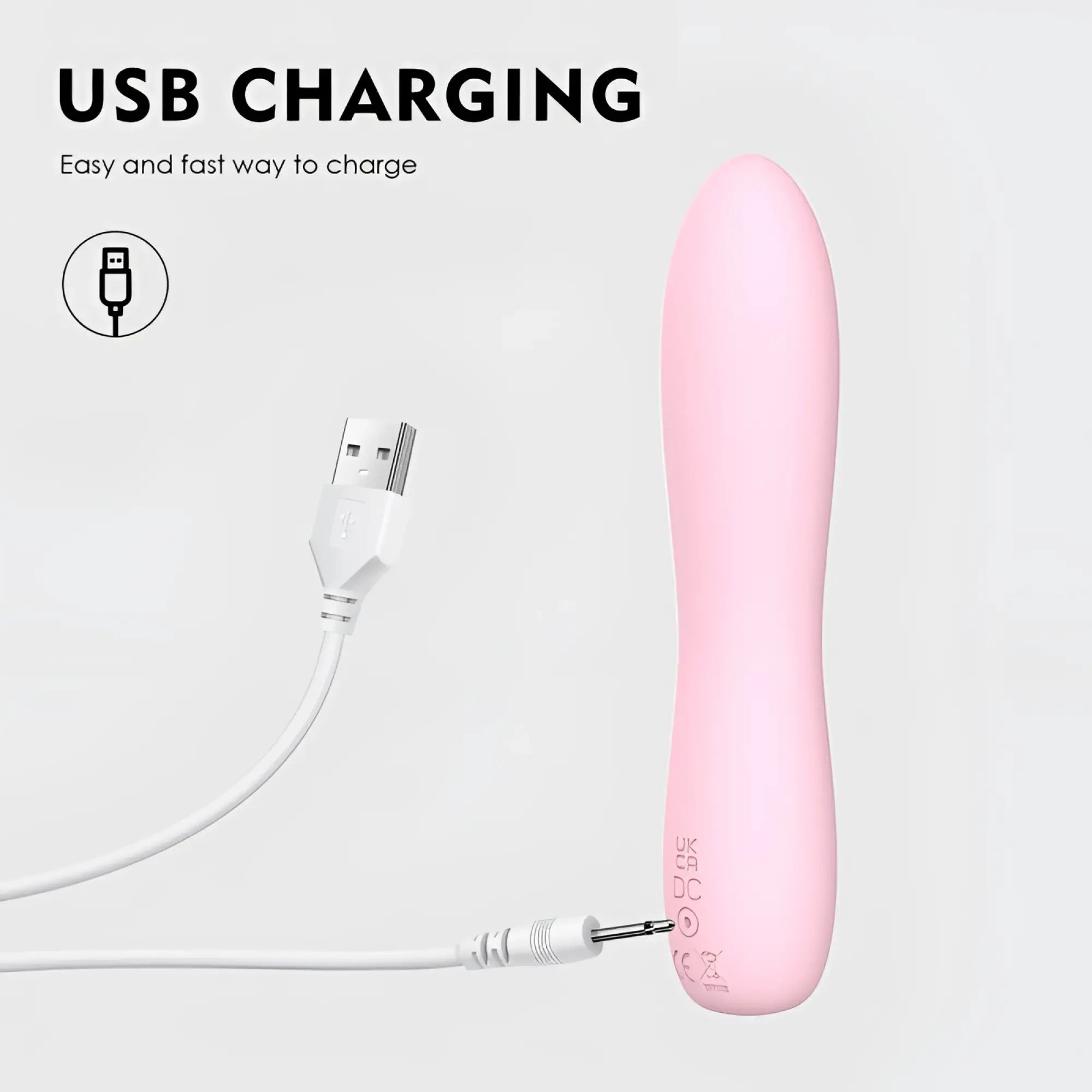 Pink silicone sxE Bella 140mm usb-charged bullet massager with white charging cable for personal use