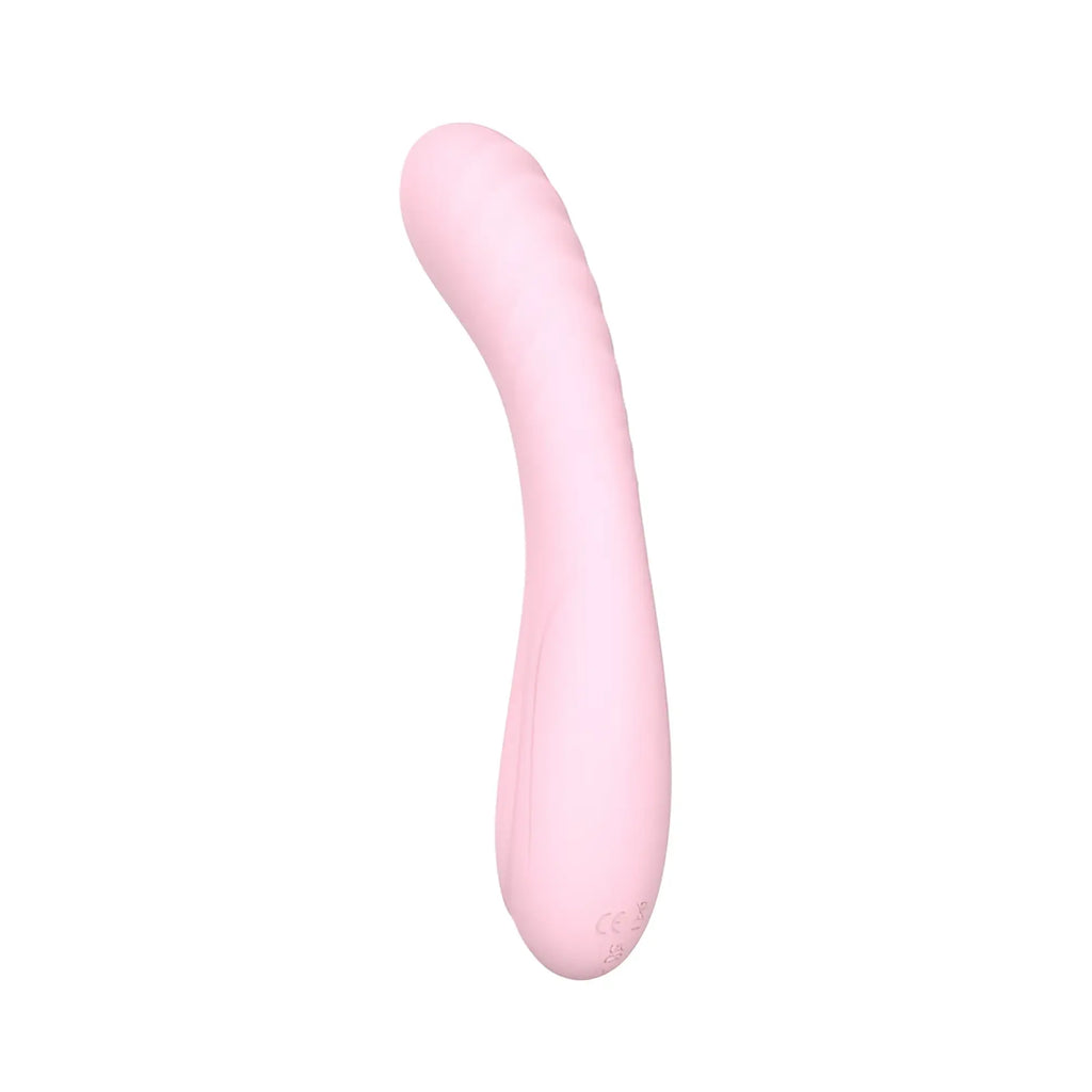 Sxé maya curve silicone vibrator in pink with curved shape and subtle textured ridges along its length