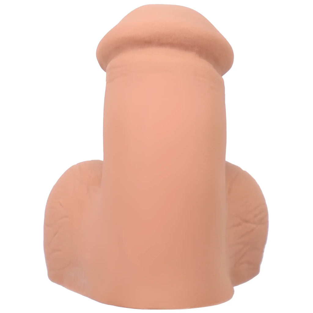 Peach-colored silicone phallus-shaped packer with realistic texture and contours from tantus on the go honey