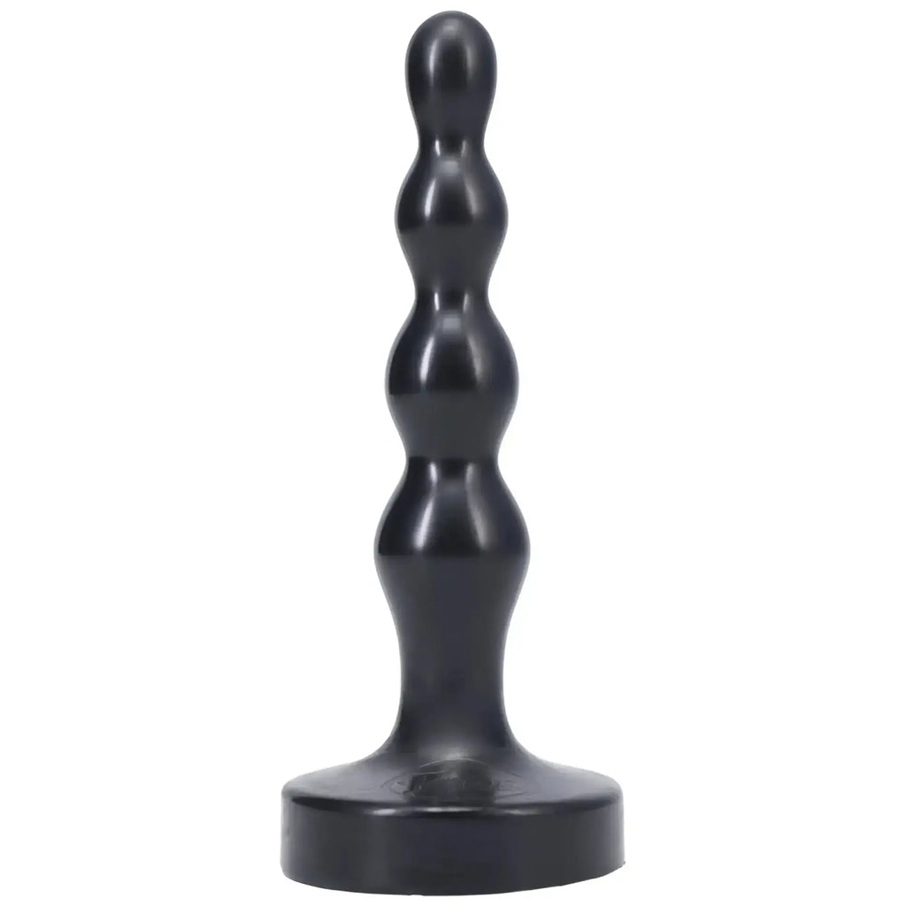 Black silicone anal plug with segmented rounded design and wide base tantus ripple small onyx front view