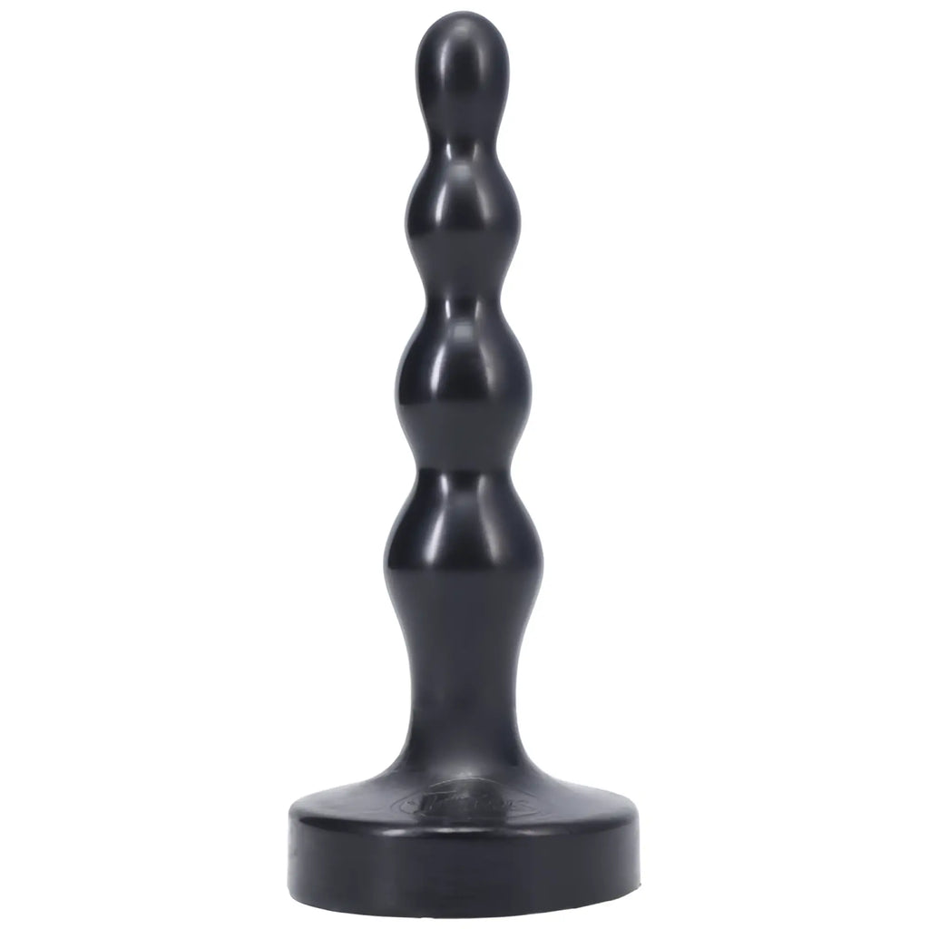 Black silicone anal plug with segmented rounded design and wide base tantus ripple small onyx front view