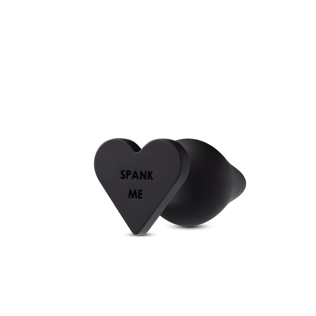Black heart-shaped anal plug with spank me engraving from Temptasia Temptasia Spank Me Butt Plug Black