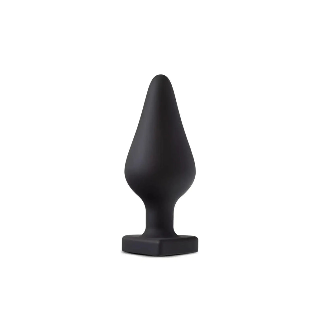 Black silicone Temptasia Spank Me butt plug with tapered teardrop head and square base for comfortable use