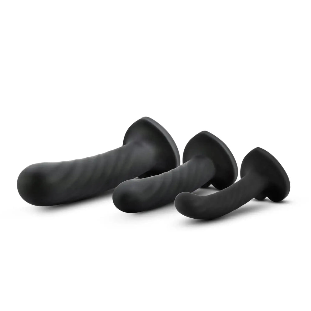 Set of three black silicone anal plugs with textured ribbed surfaces and flared bases from Temptasia twist kit