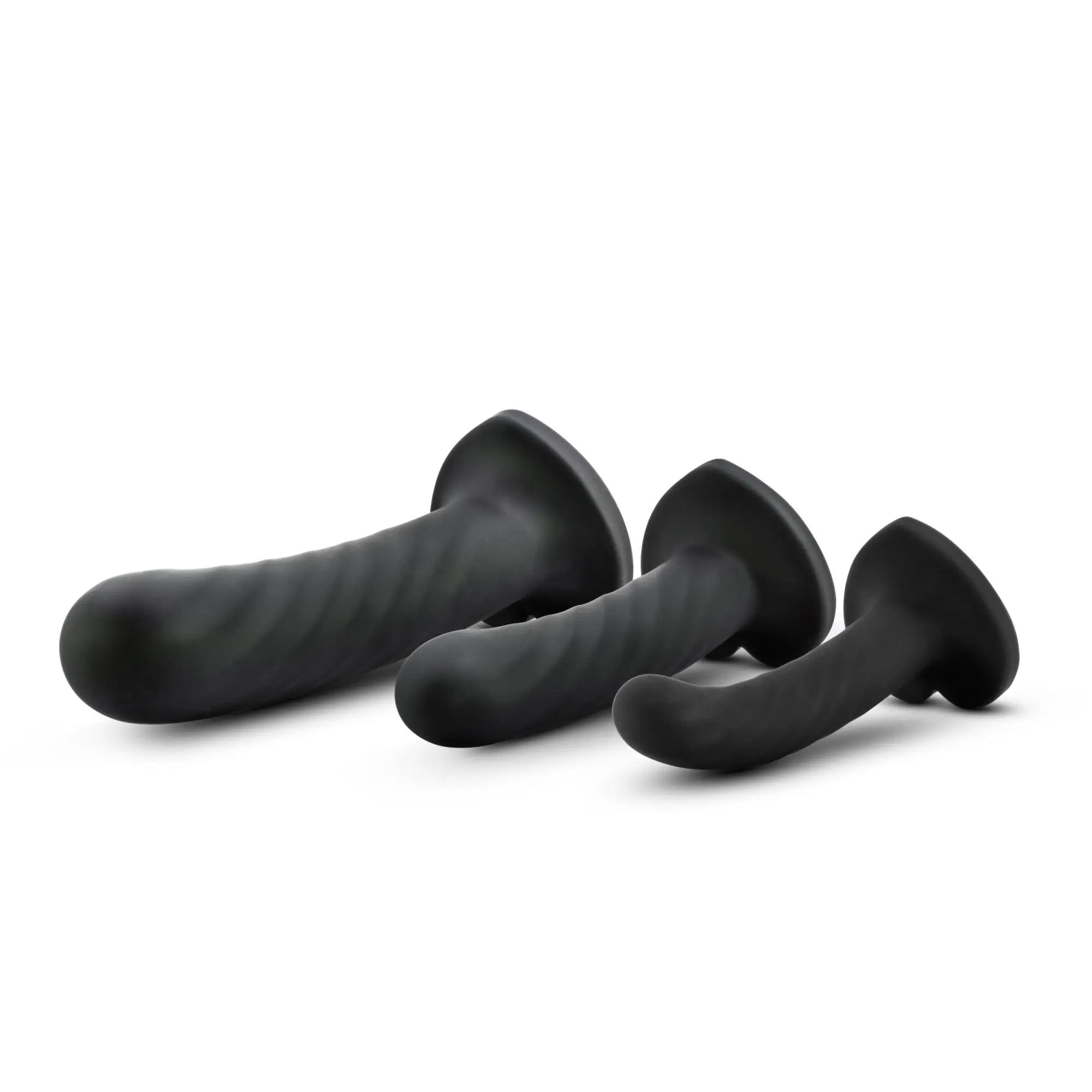 Set of three black silicone anal plugs with textured ribbed surfaces and flared bases from Temptasia twist kit