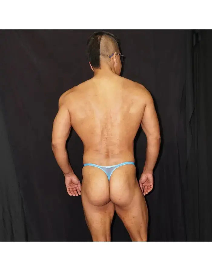 Blue tulle thong underwear by Arroyman featuring a minimal design and sheer fabric shown on a model from the back.