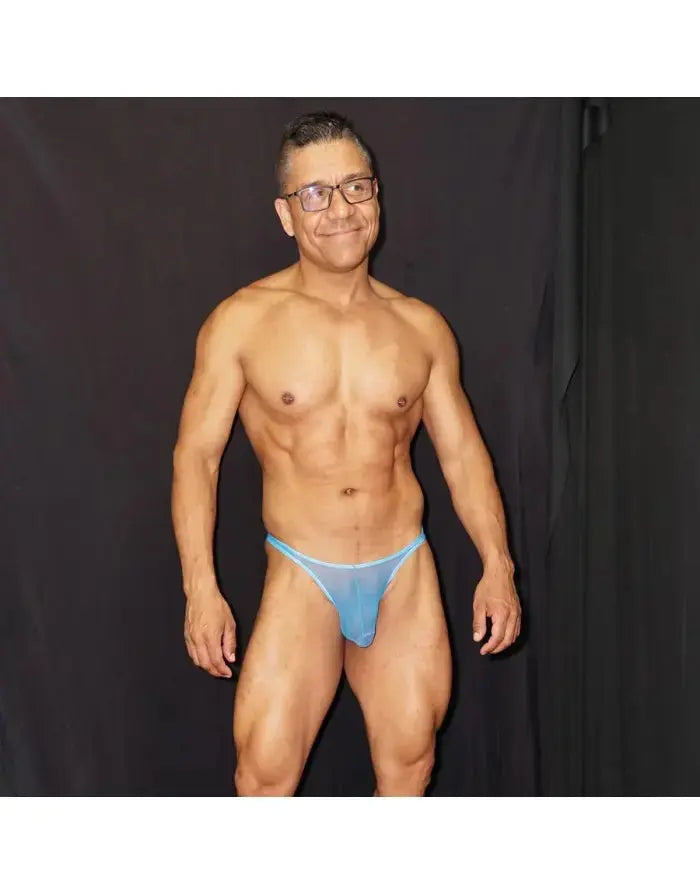 Blue tulle thong underwear by Arroyman featuring a sheer design and minimal coverage modeled by a man.