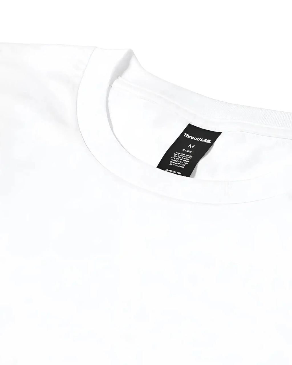 Close-up of a plain white crewneck t-shirt with a black ThreadLAB brand tag visible at the inner neckline.