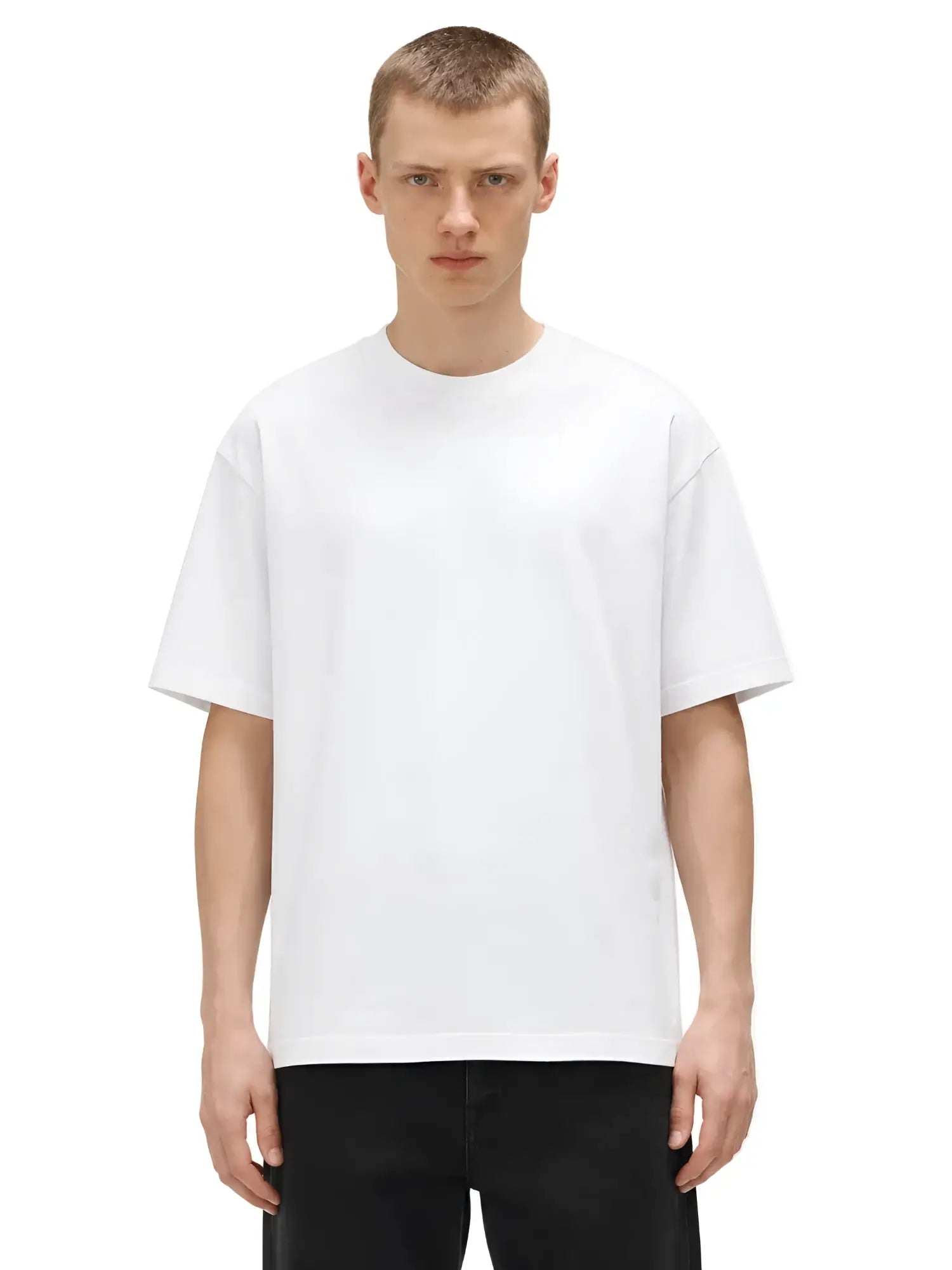 Model wearing a premium white heavyweight crewneck t-shirt with a relaxed, boxy fit against a plain white background.