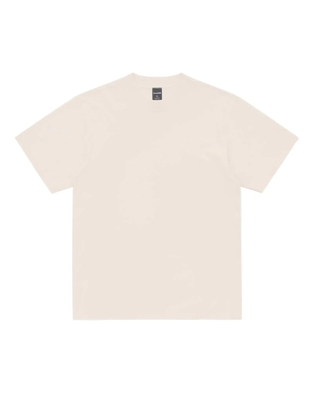 A plain cream-colored short-sleeve Superior Tee with a crew neck and a visible brand tag on the inner collar.