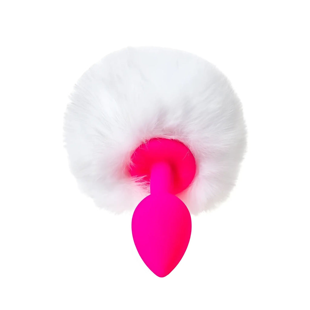 A vibrant pink silicone todo todo sweet bunny anal plug with a fluffy white faux fur pom pom top