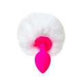 A vibrant pink silicone todo todo sweet bunny anal plug with a fluffy white faux fur pom pom top