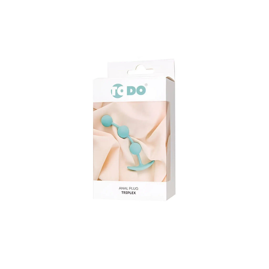 Teal silicone anal plug with three spherical beads and flared base in white do brand box from todo triplex collection
