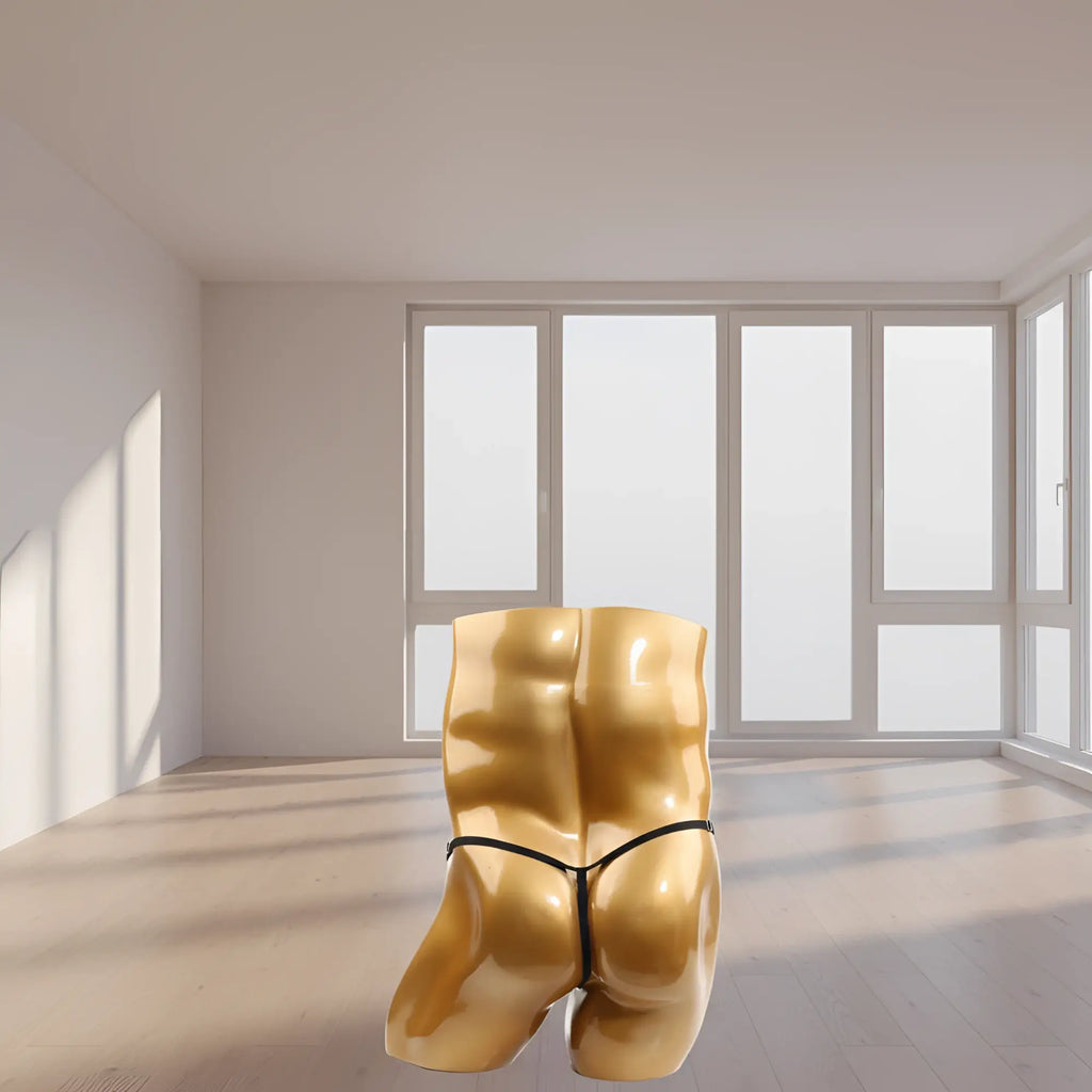 Golden glossy sculpture of a muscular posterior showing the back side of the u-station foundation thong adjustable black mannequin torso