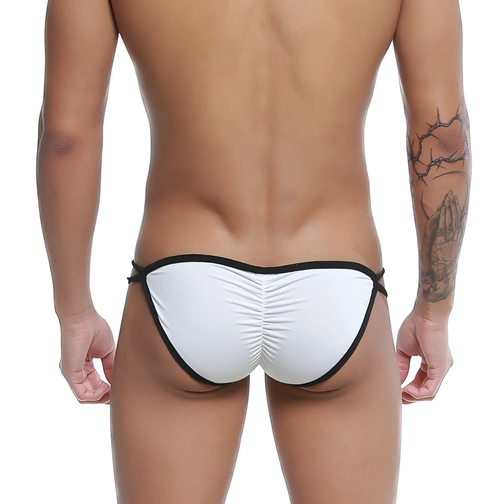 White swim trunks with black trim and ruched back design shown from the back in u-station skeleton bikini white u0062-100