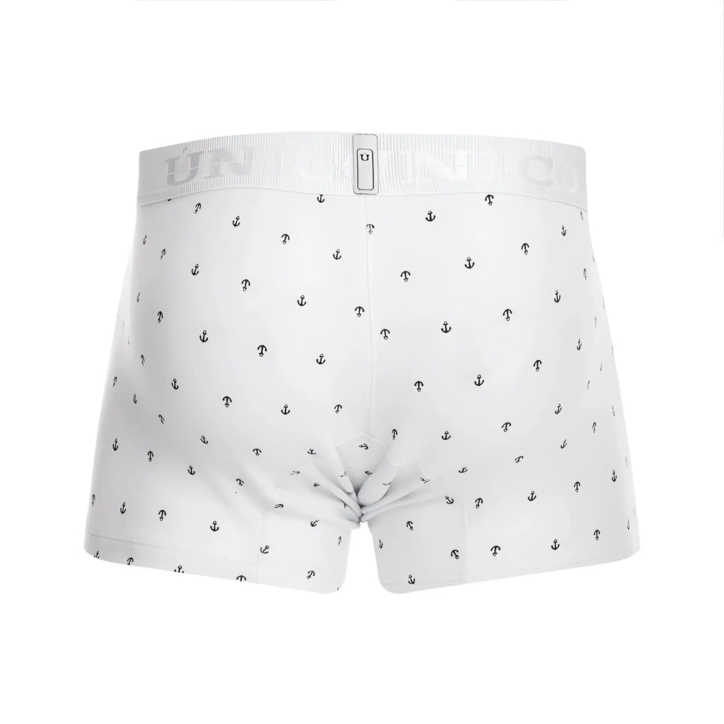 White boxer briefs with subtle black anchor pattern and ribbed waistband featuring unico brand logo in color white