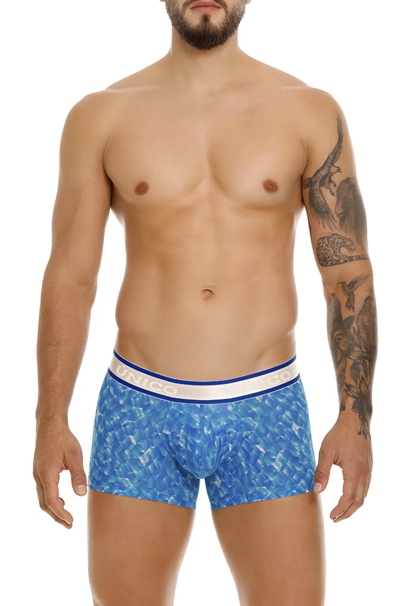 Blue patterned Unico Palindromo trunks with white and blue elastic waistband featuring brand name in color 46-blue