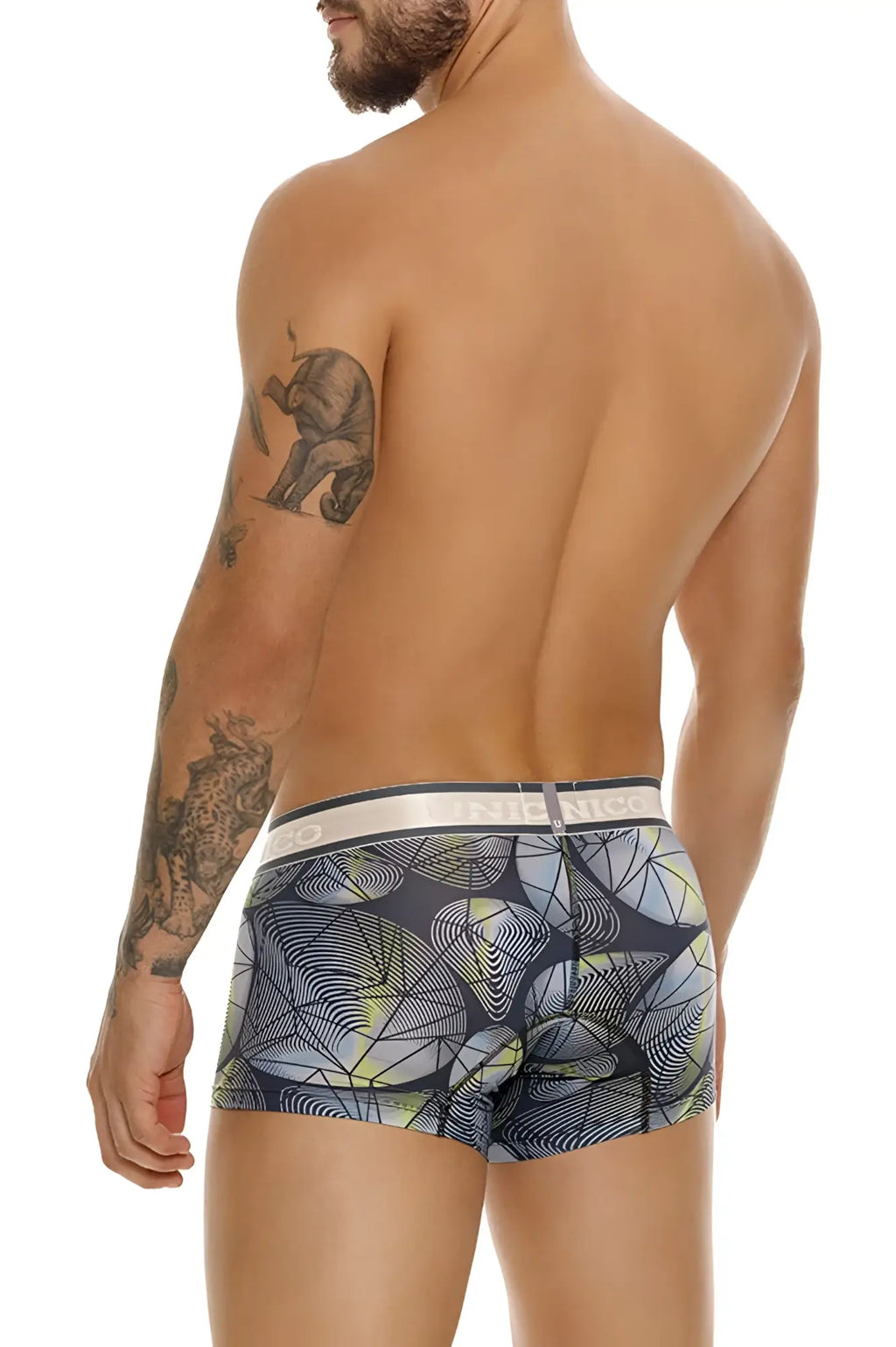 Men’s Unico Resplandecer trunks in gray with bold geometric pattern lime green and black on dark fabric