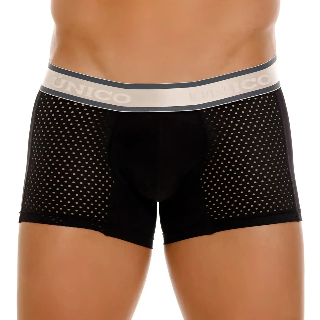 Black unico tamiz trunks with perforated mesh design and gray waistband featuring the brand name