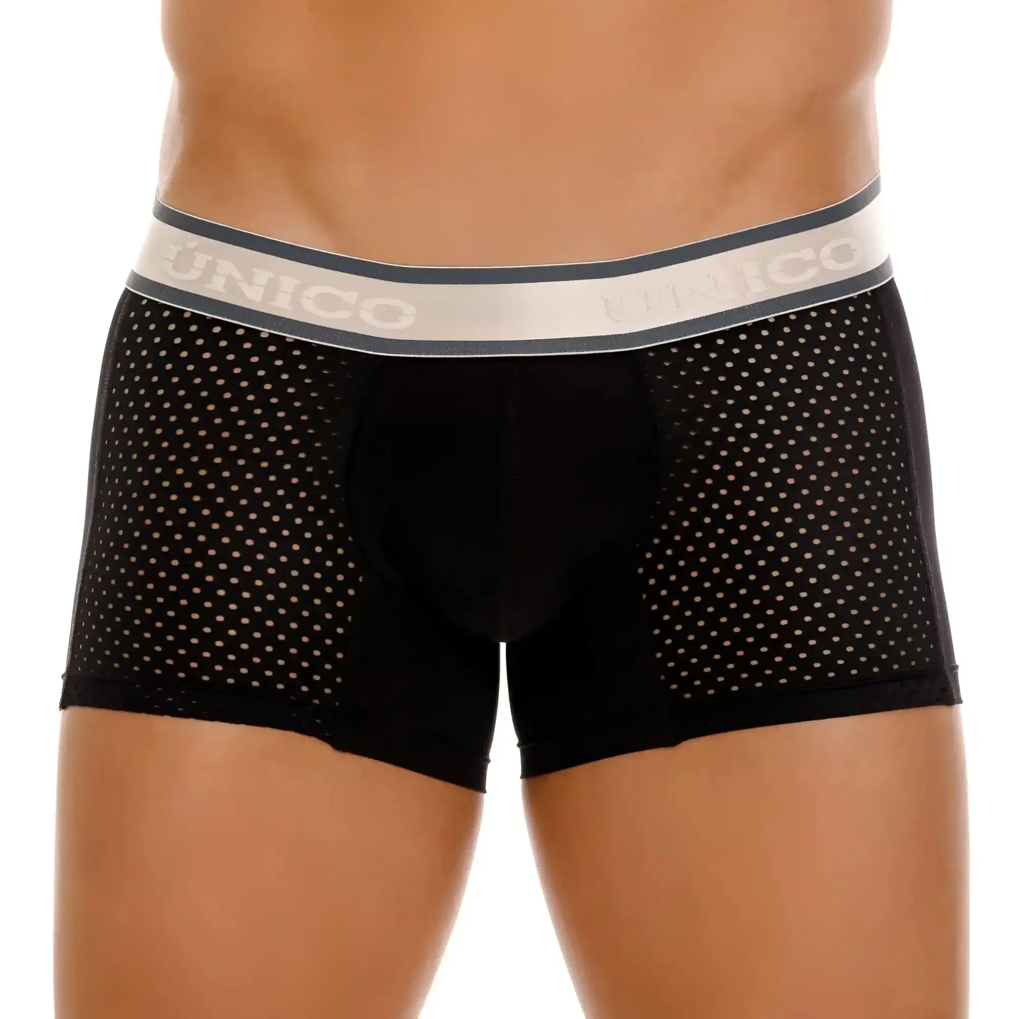 Black unico tamiz trunks with perforated mesh design and gray waistband featuring the brand name
