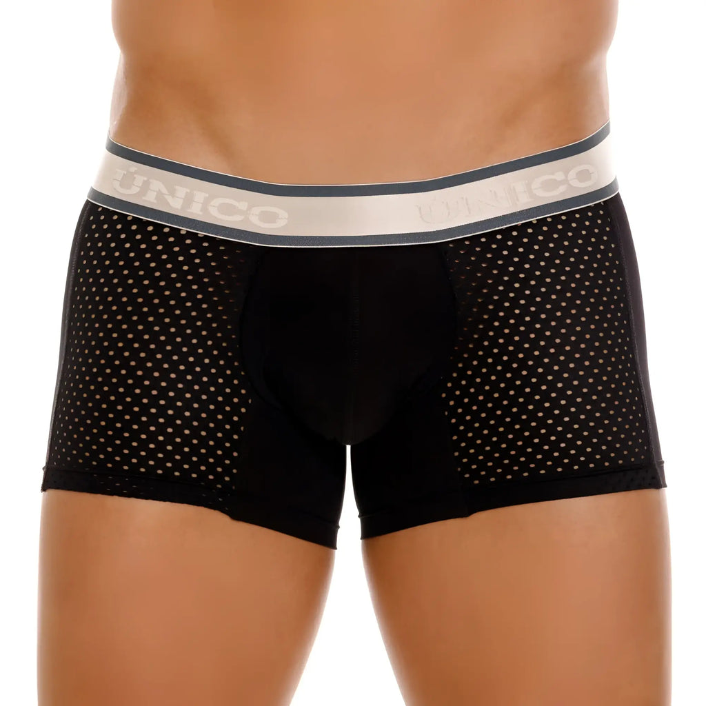 Black unico tamiz trunks with perforated mesh design and gray waistband featuring the brand name