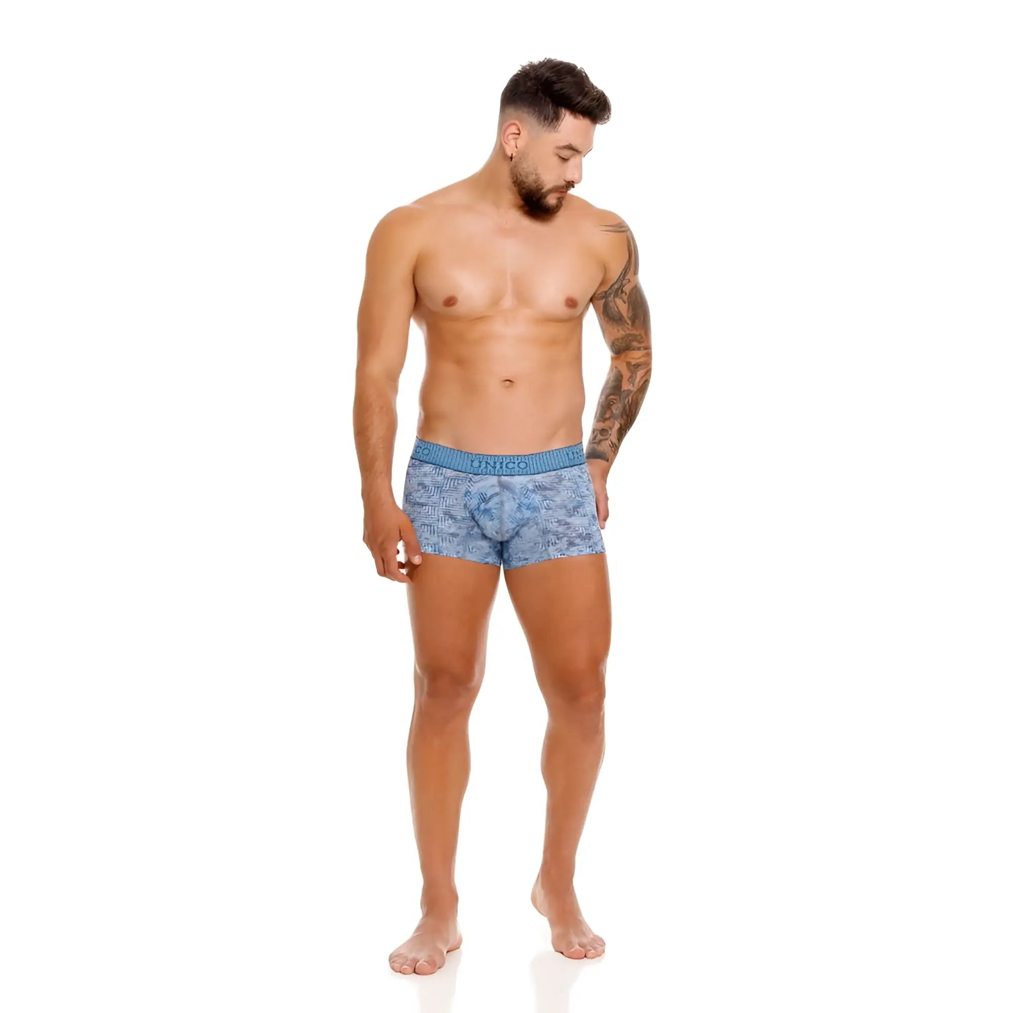 Blue patterned men’s boxer briefs with solid blue waistband featuring Unico brand name ostion trunks color 46-blue
