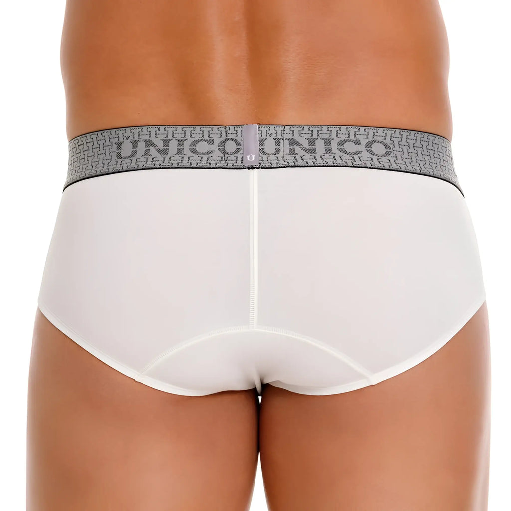 White unico marfil briefs with a gray patterned waistband featuring the unico logo for comfortable wear