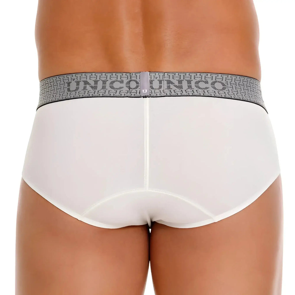 White unico marfil briefs with a gray patterned waistband featuring the unico logo for comfortable wear