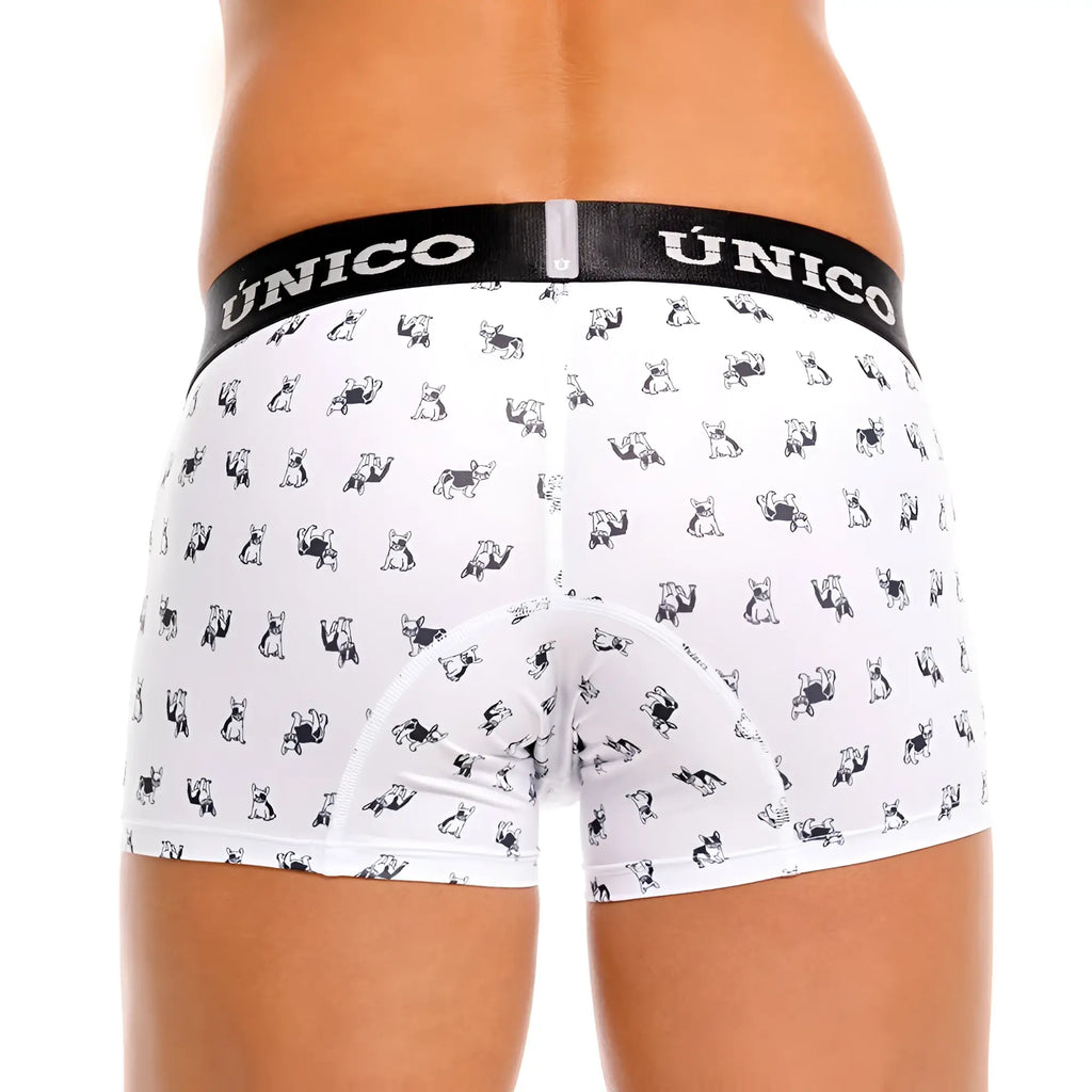 White briefs with black and white cartoon dog pattern featuring the único brand on the elastic waistband
