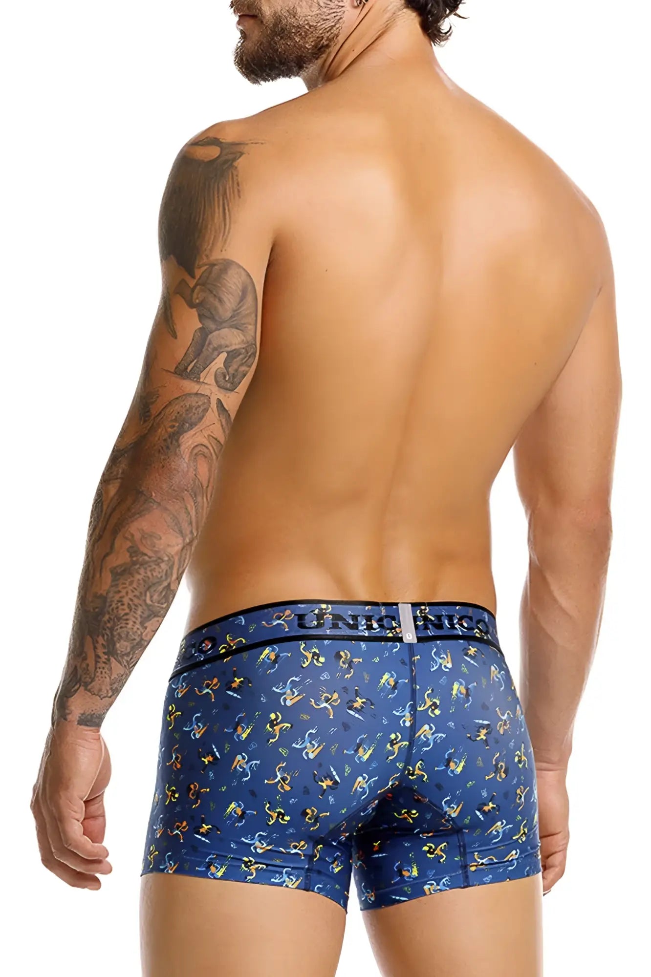 Blue boxer briefs with playful yellow and white cartoon figures and unico unic nics waistband logo color 46-blue