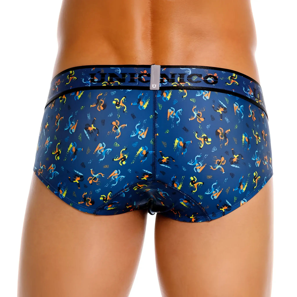Unico 25060101106 pacer briefs in blue feature vibrant orange and yellow stylized figures on soft patterned fabric