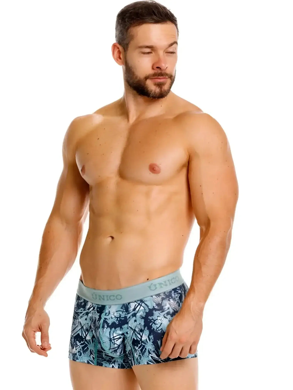 Unico 26040100112 blue trunks on a model, front view lifestyle shot.